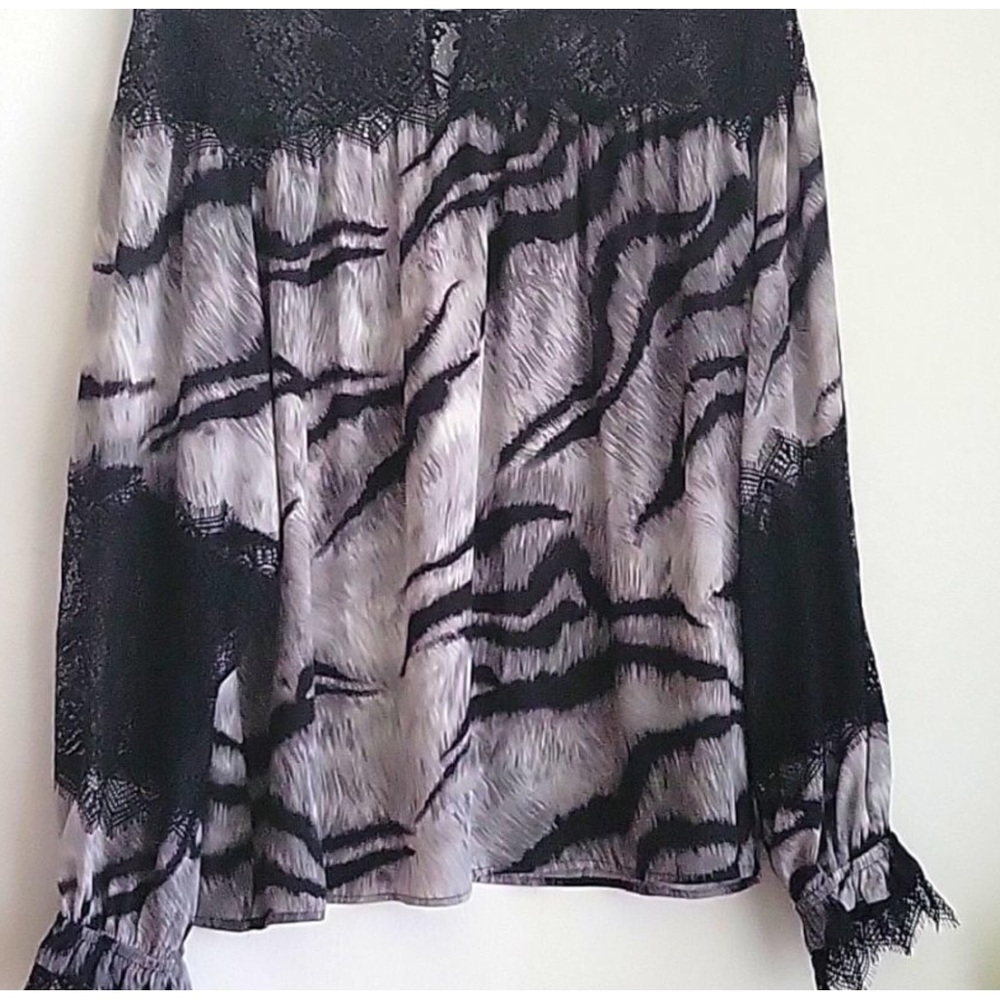WHBM lace detail top , worn one time size small but fits more like a medium